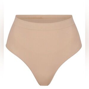 Skims seamless sculpt mid waist thong new without tags size xs & xxs color mica